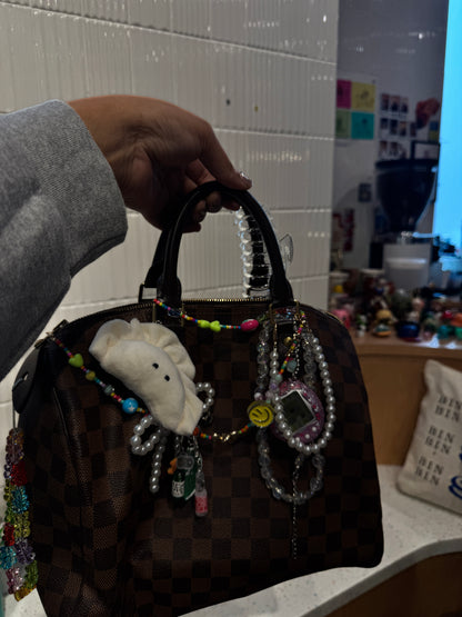 Tamagotchi-inspired bag charm